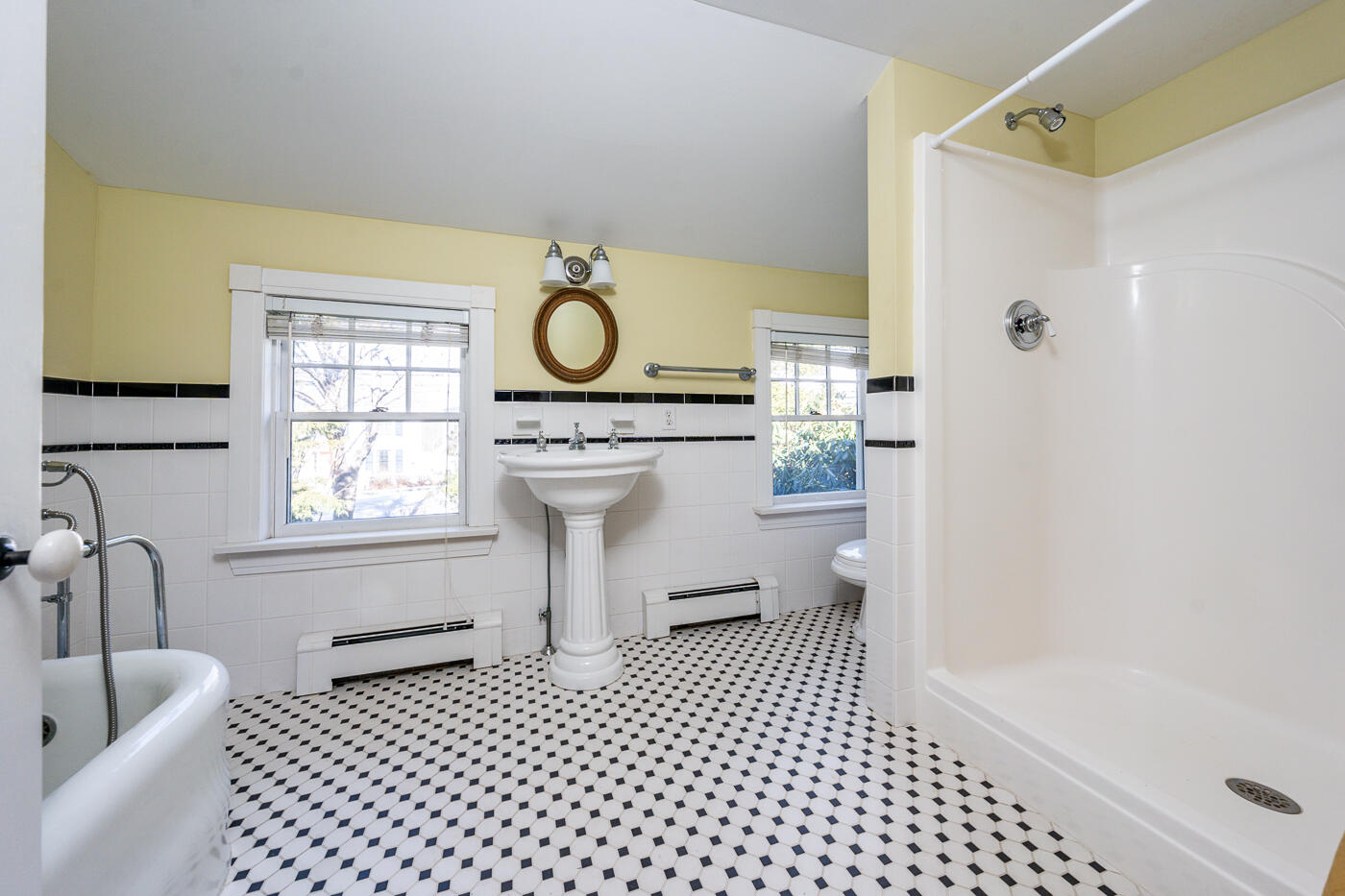 223 Main Street Wellfleet, MA 02667 - Photo 44 of 70 a bathroom with a sink a toilet a window and shower