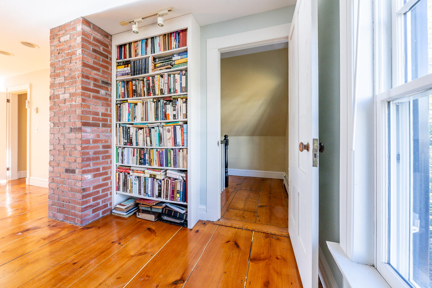 223 Main Street Wellfleet, MA 02667 - Photo 50 of 70 a living room with furniture and a book shelf