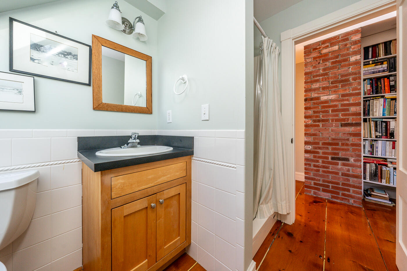 223 Main Street Wellfleet, MA 02667 - Photo 53 of 70 a bathroom with a sink and a mirror