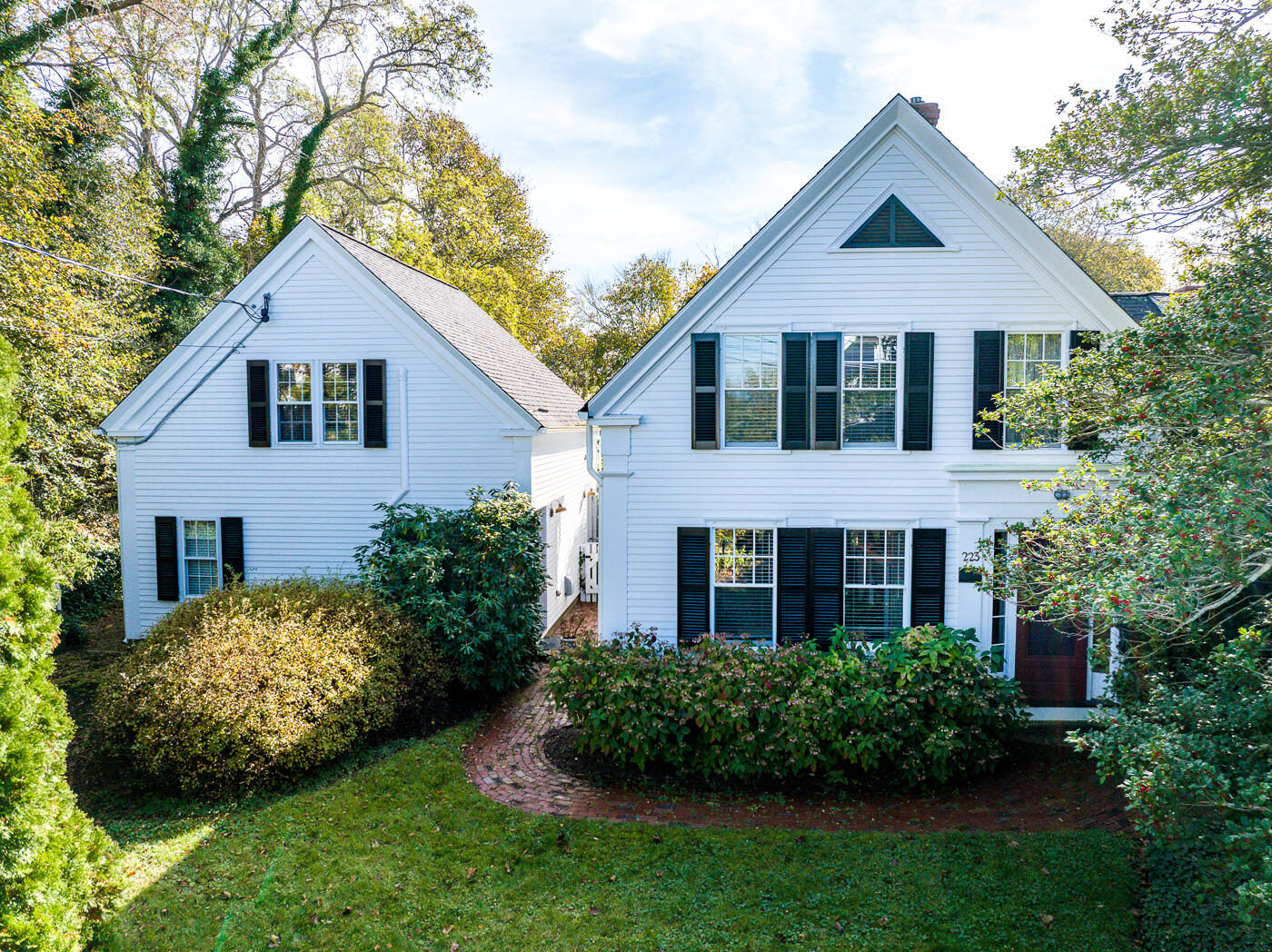 223 Main Street Wellfleet, MA 02667 - Photo 9 of 70 a front view of a house with a garden