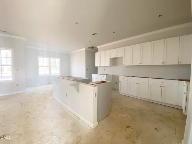 a view of a kitchen with a sink cabinets and a window