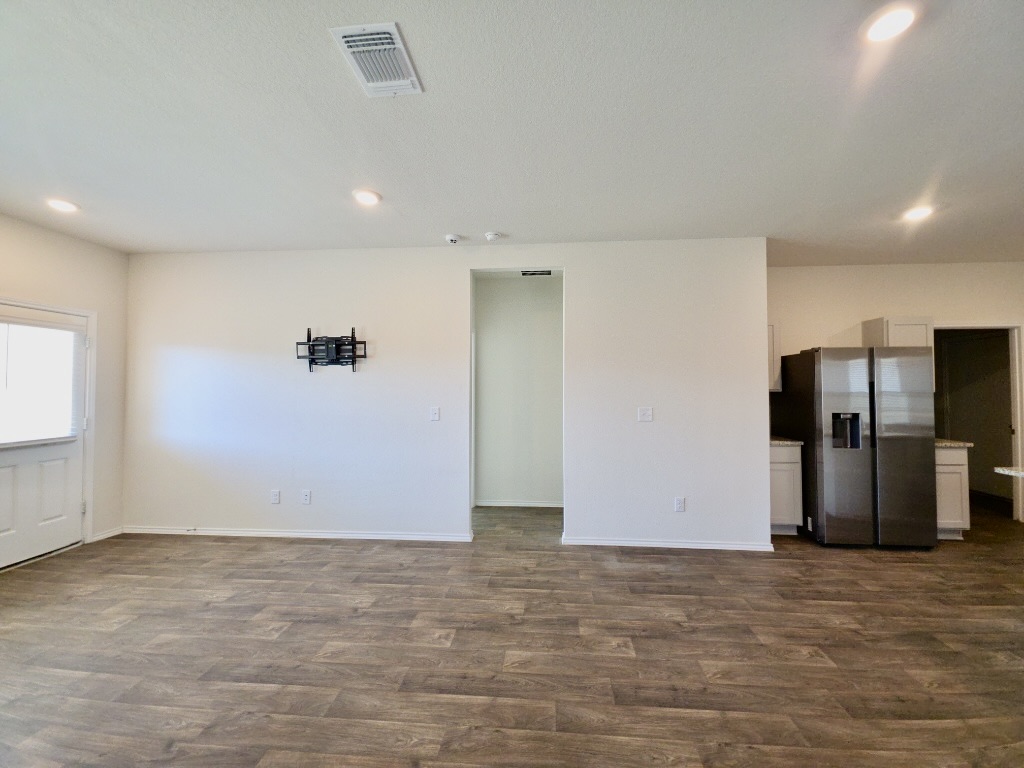 13525 Open Wagon Trail Elgin, TX 78621 - Photo 7 of 26 Living room featuring recessed lighting and dark wood finished floors