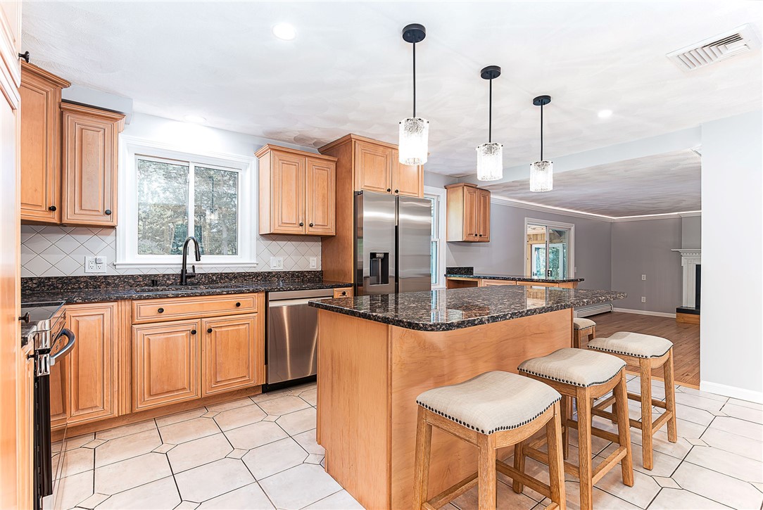 680 Fletcher Road North Kingstown, RI 02852 - Photo 8 of 41 Kitchen features tile floor and backsplash, center island and reading nook
