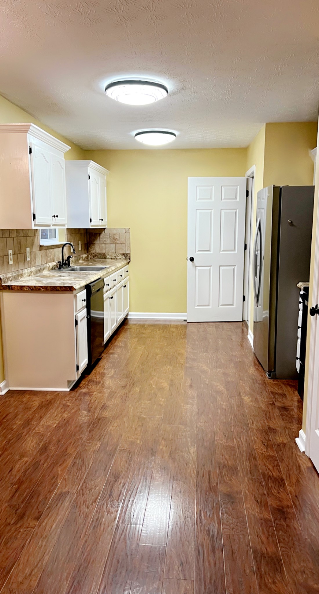 362 Bandera Lane Springfield, TN 37172 - Photo 5 of 16 a large kitchen with cabinets and wooden floor