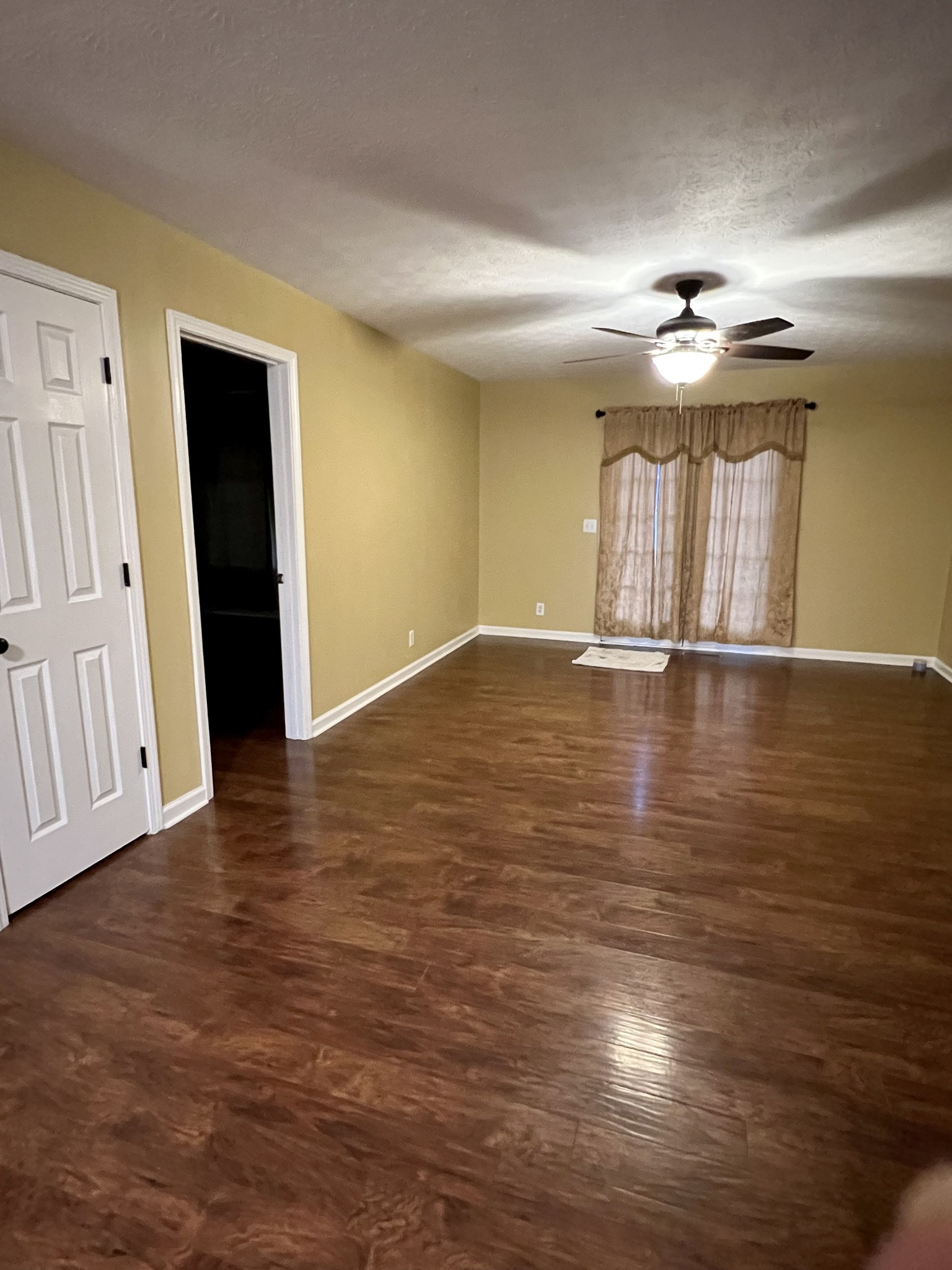 362 Bandera Lane Springfield, TN 37172 - Photo 9 of 16 an empty room with wooden floor and windows