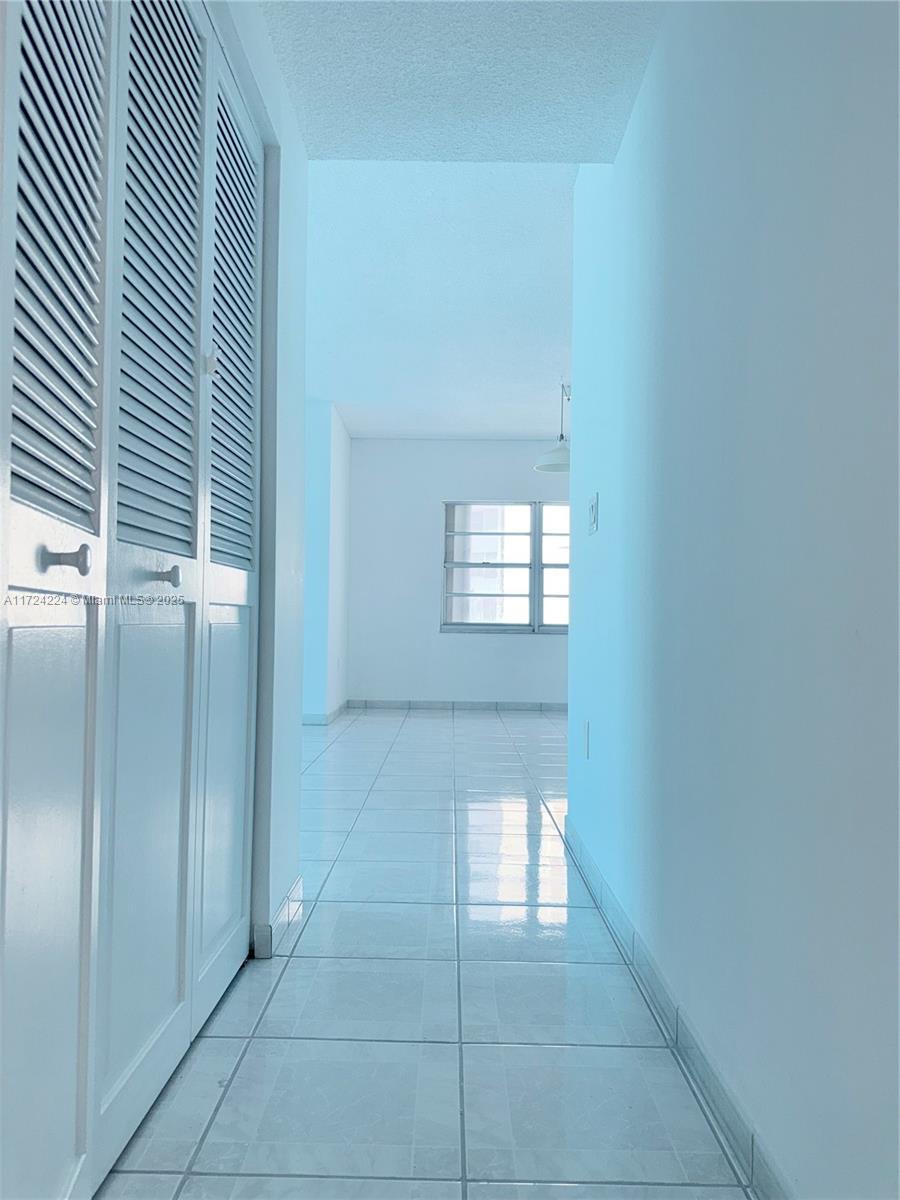 500 Bayview Drive, Unit 1031 Sunny Isles Beach, FL 33160 - Photo 19 of 40 a view of an empty room with windows