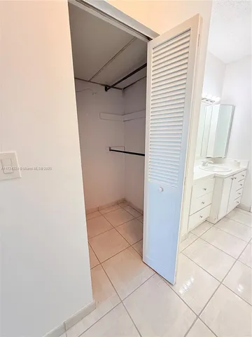a view of walk in closet with window