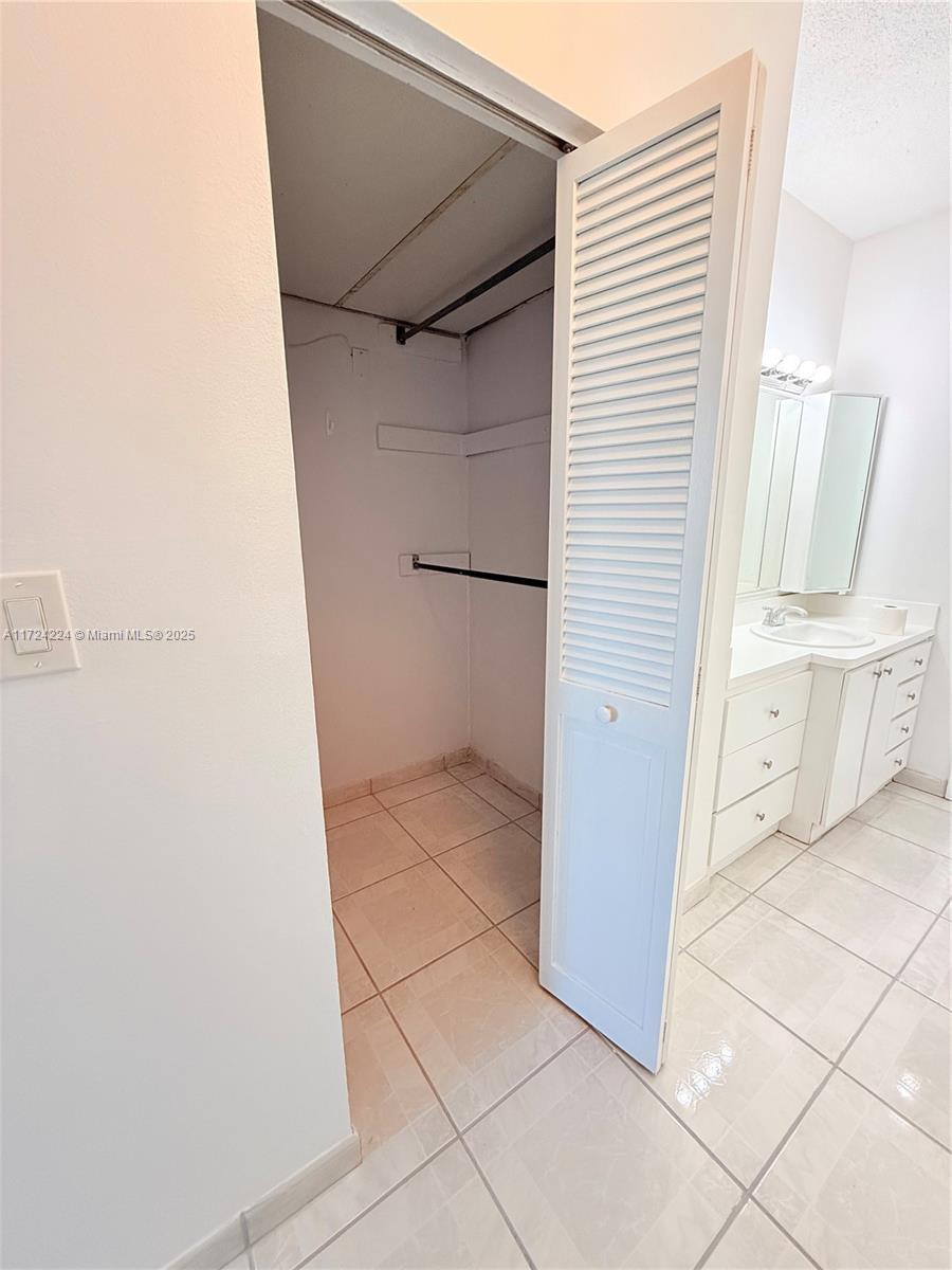 500 Bayview Drive, Unit 1031 Sunny Isles Beach, FL 33160 - Photo 22 of 40 a view of walk in closet with window