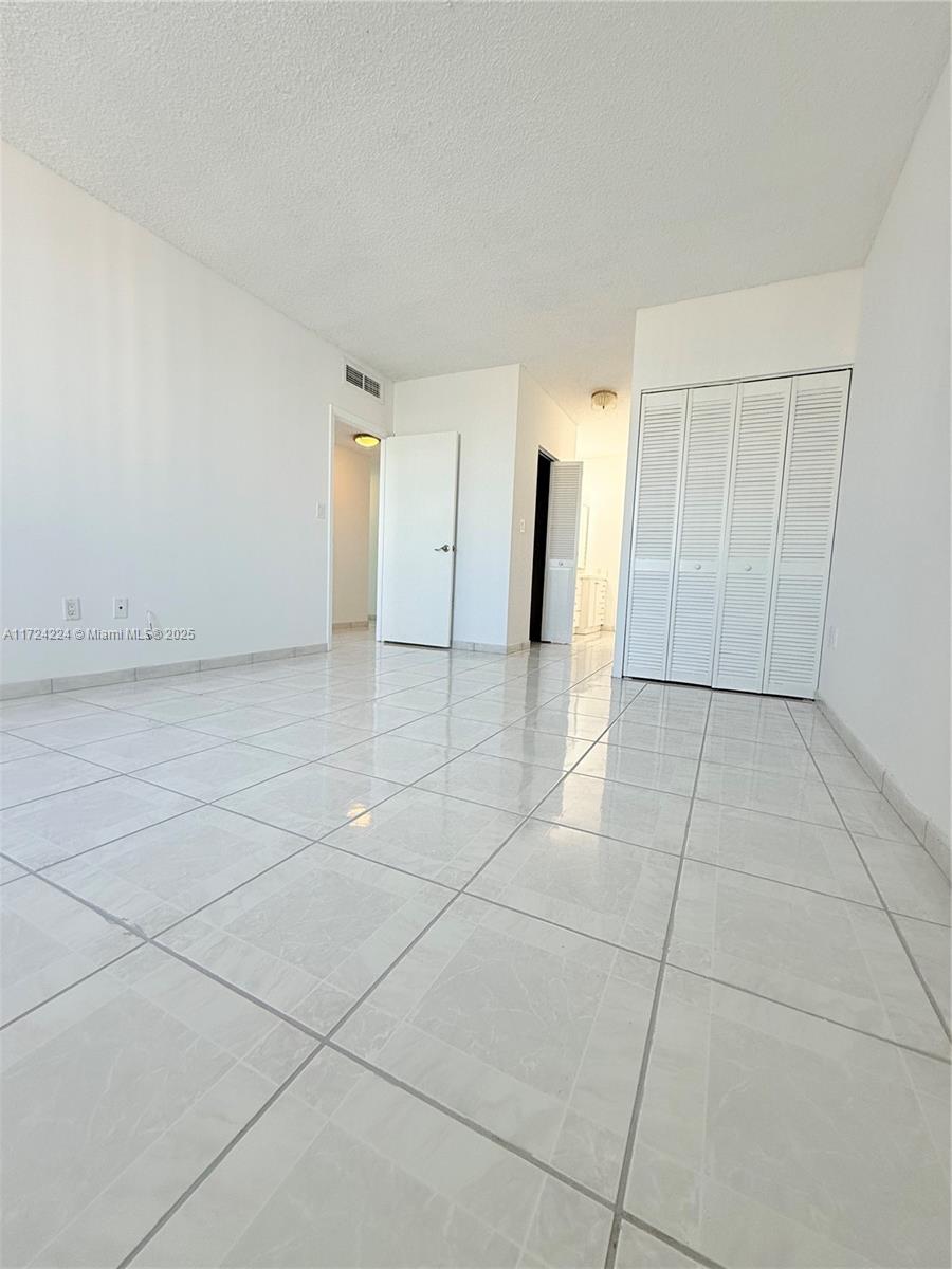 500 Bayview Drive, Unit 1031 Sunny Isles Beach, FL 33160 - Photo 23 of 40 a view of a livingroom with an empty space