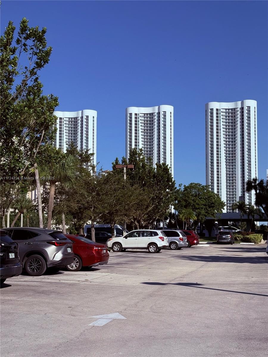 500 Bayview Drive, Unit 1031 Sunny Isles Beach, FL 33160 - Photo 3 of 40 a cars parked in front of a building