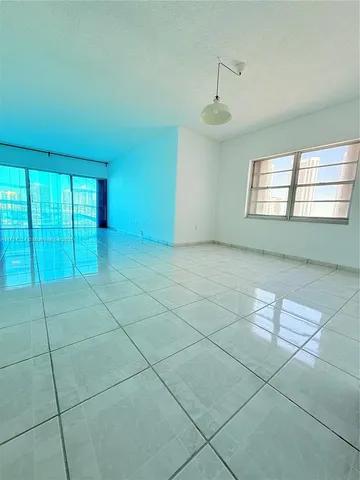 an empty room with a bathroom