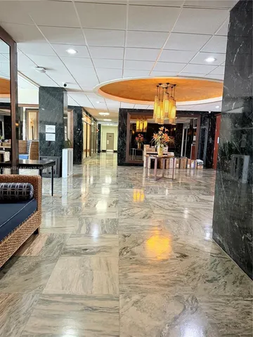 a view of a swimming pool with sitting area