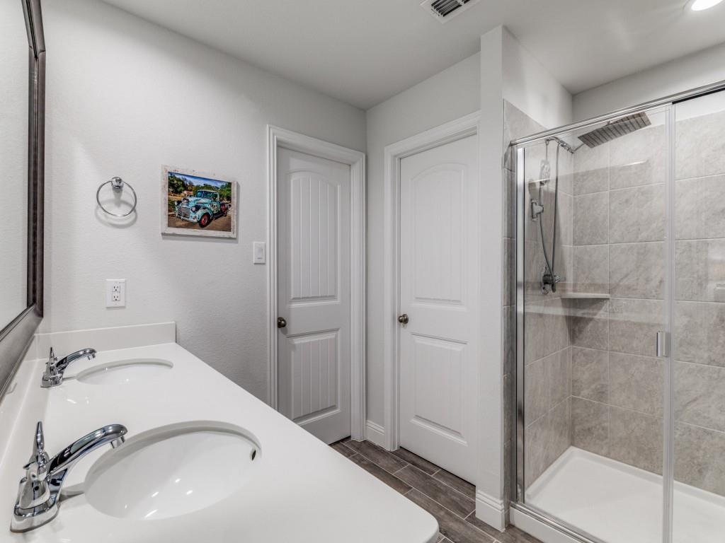 5944 Bursey Road Watauga, TX 76148 - Photo 15 of 25 a bathroom with a sink and shower