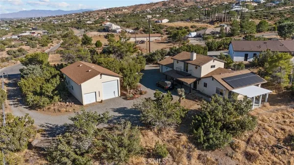 an aerial view of residential house with outdoor space