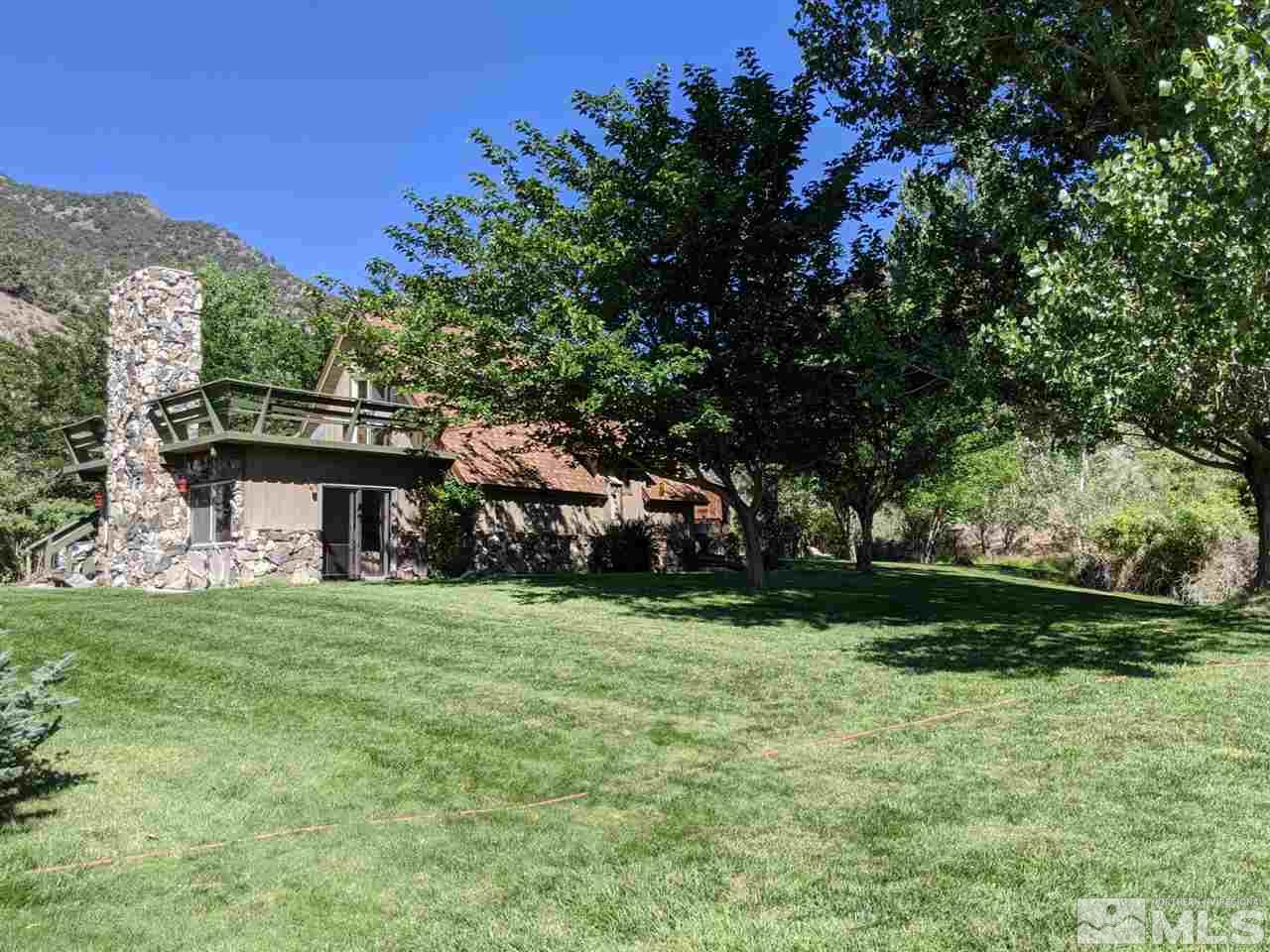 6 Smokey Court Austin, NV 89310 - Photo 1 of 20 a view of a house with a big yard and large trees