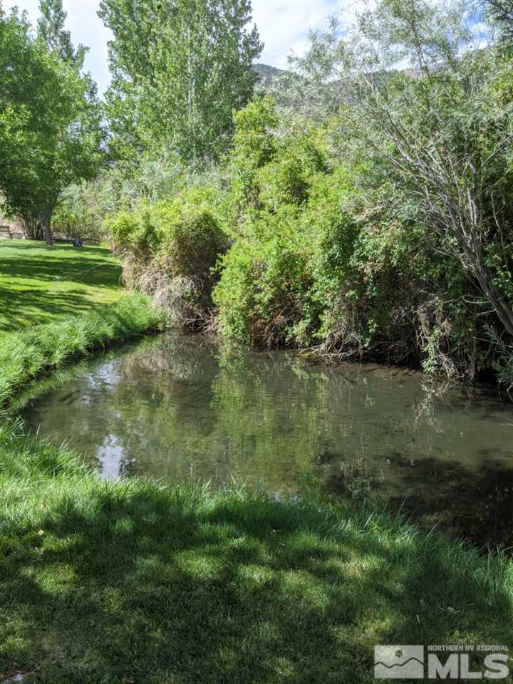 6 Smokey Court Austin, NV 89310 - Photo 9 of 20 a view of a lake with a yard