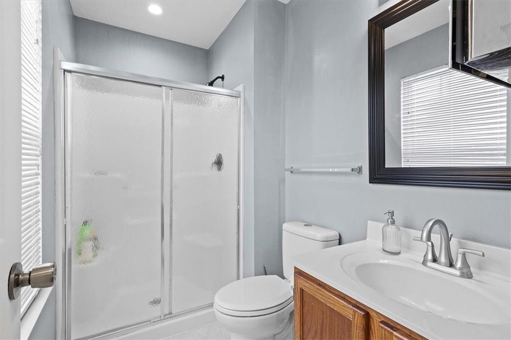 1025 Rural Ridge Drive Cheswick, PA 15024 - Photo 13 of 23 a bathroom with a sink a toilet and shower