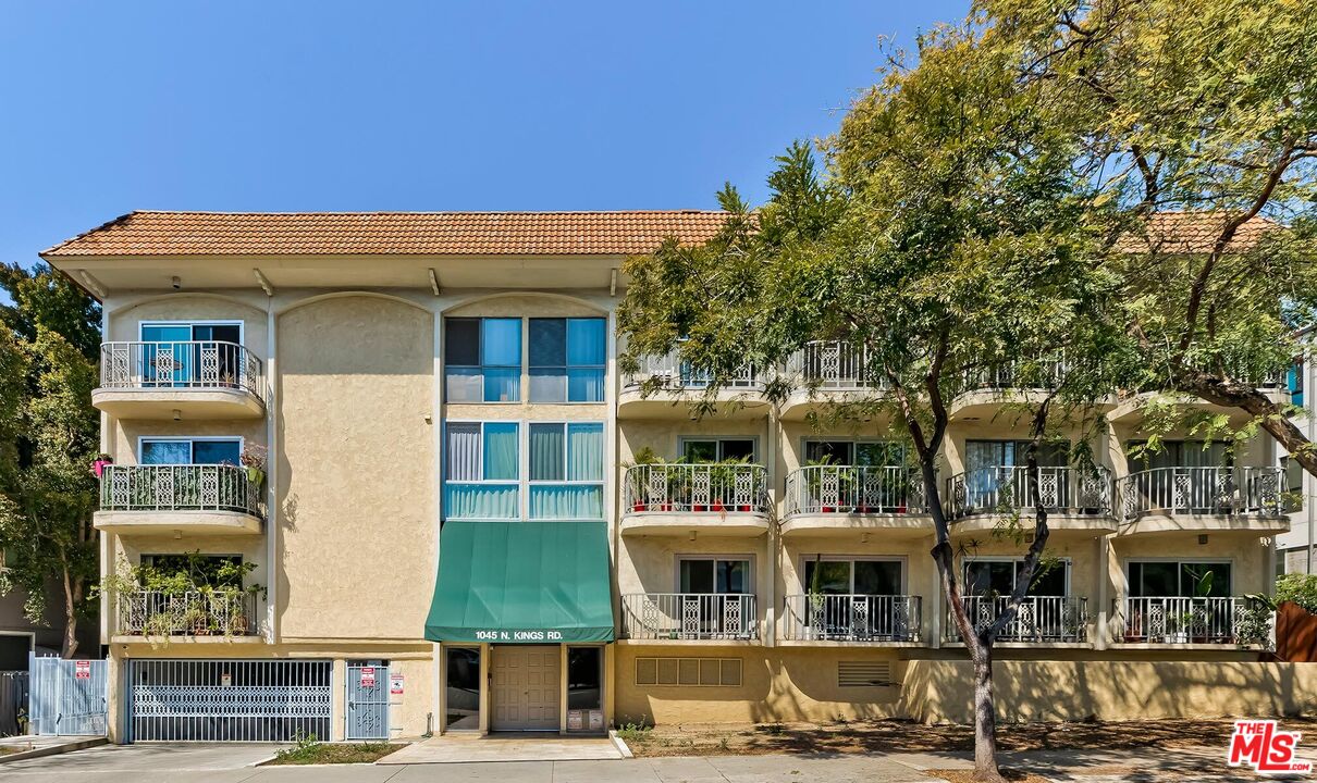 1045 North Kings Road, Unit 310 West Hollywood, CA 90069 - Photo 13 of 14 a front view of a building with street view