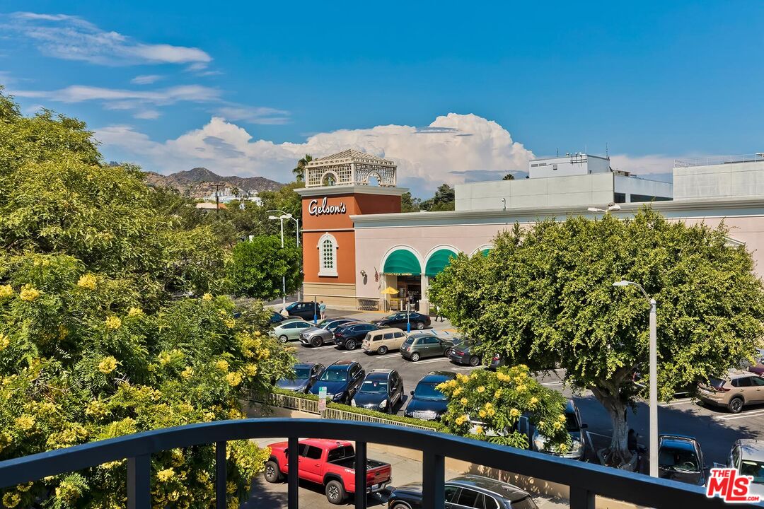 1045 North Kings Road, Unit 310 West Hollywood, CA 90069 - Photo 5 of 14 a view of a house with a flower garden