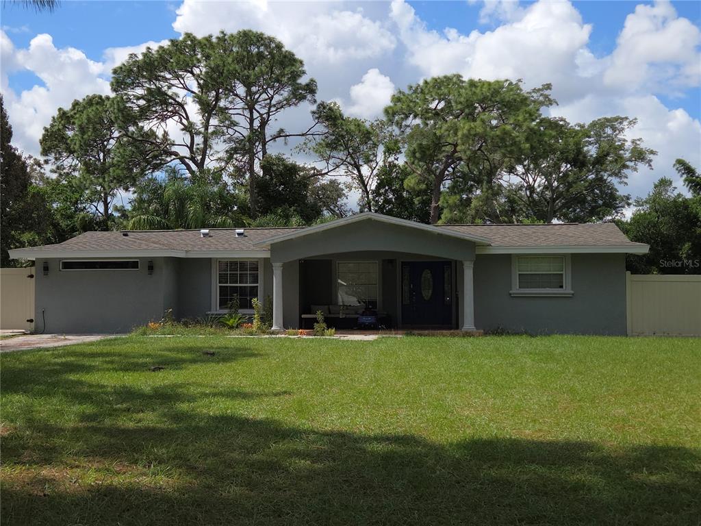 a brick house with a yard