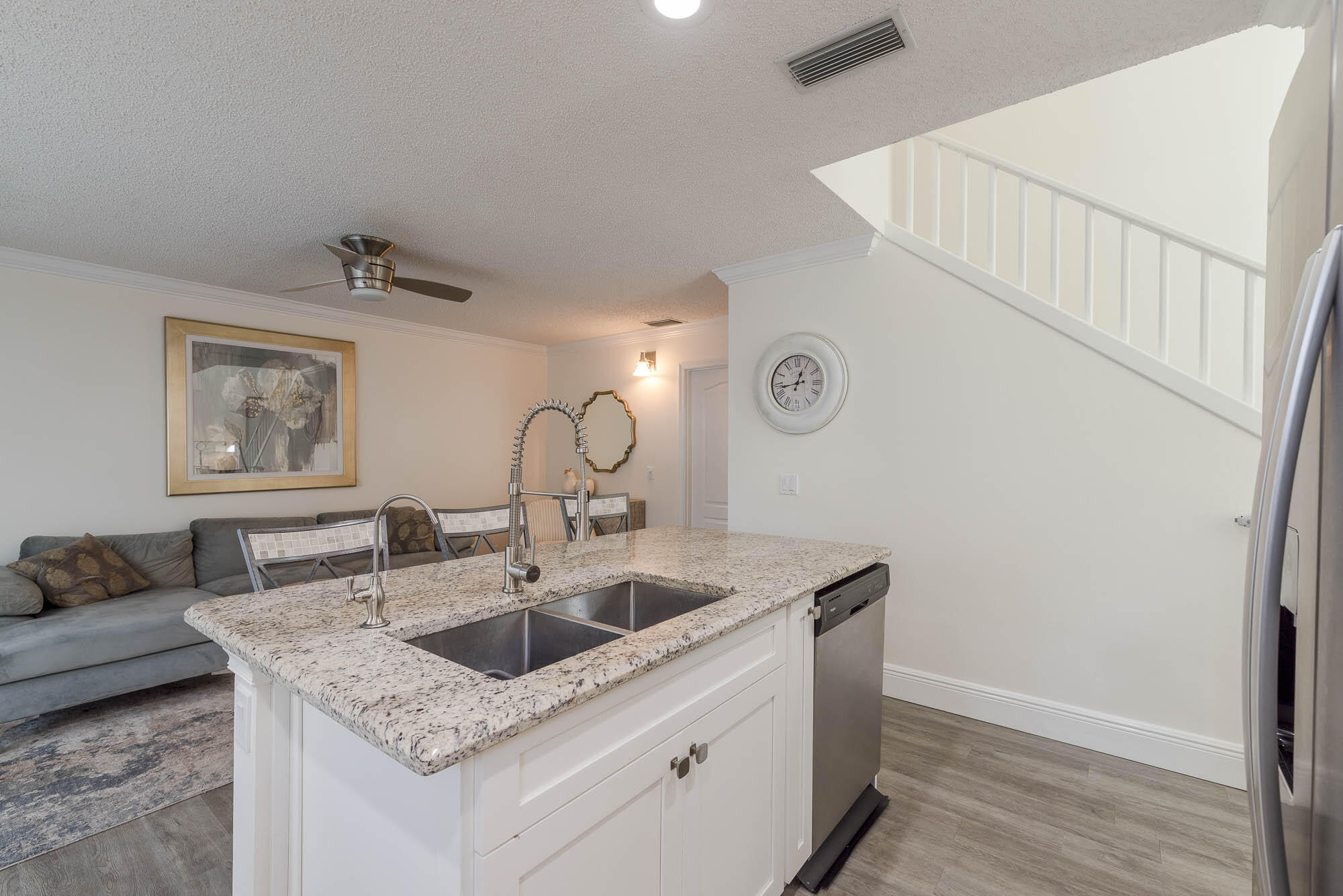25 Commodore Place Palm Beach Gardens, FL 33418 - Photo 13 of 68 a kitchen with a sink a stove and cabinets