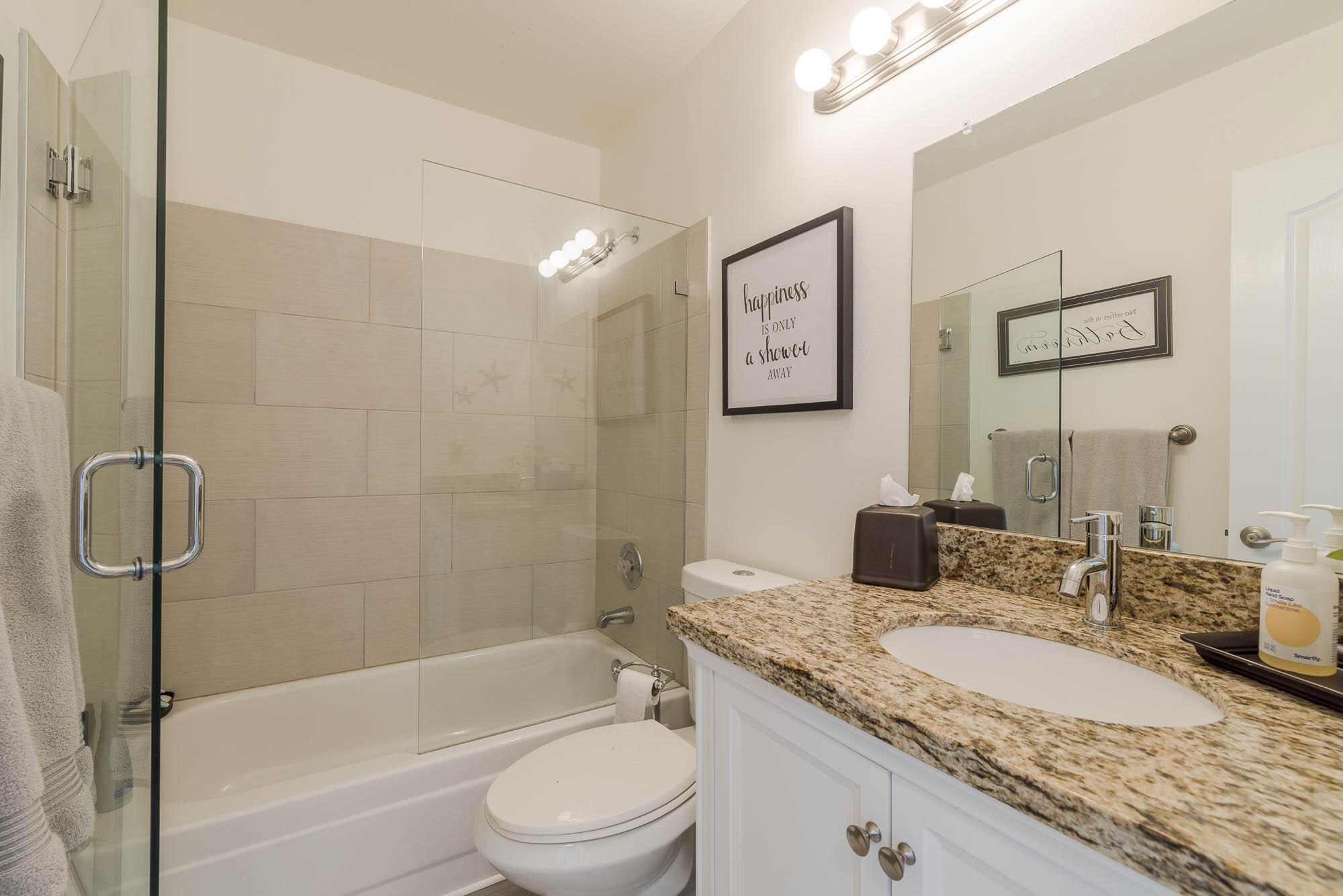 25 Commodore Place Palm Beach Gardens, FL 33418 - Photo 23 of 68 a bathroom with a granite countertop sink toilet and shower