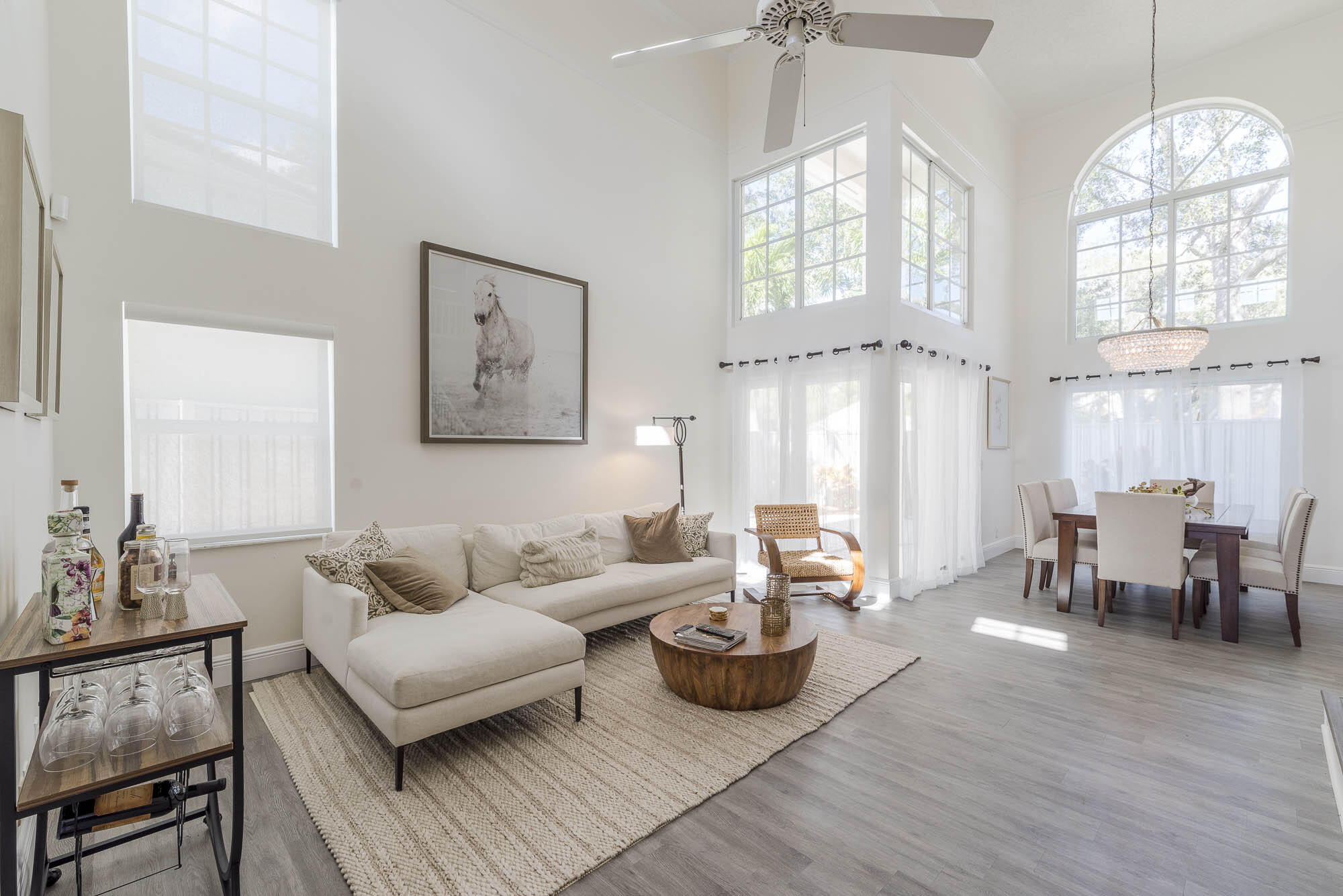 25 Commodore Place Palm Beach Gardens, FL 33418 - Photo 3 of 68 a living room with furniture and a large window