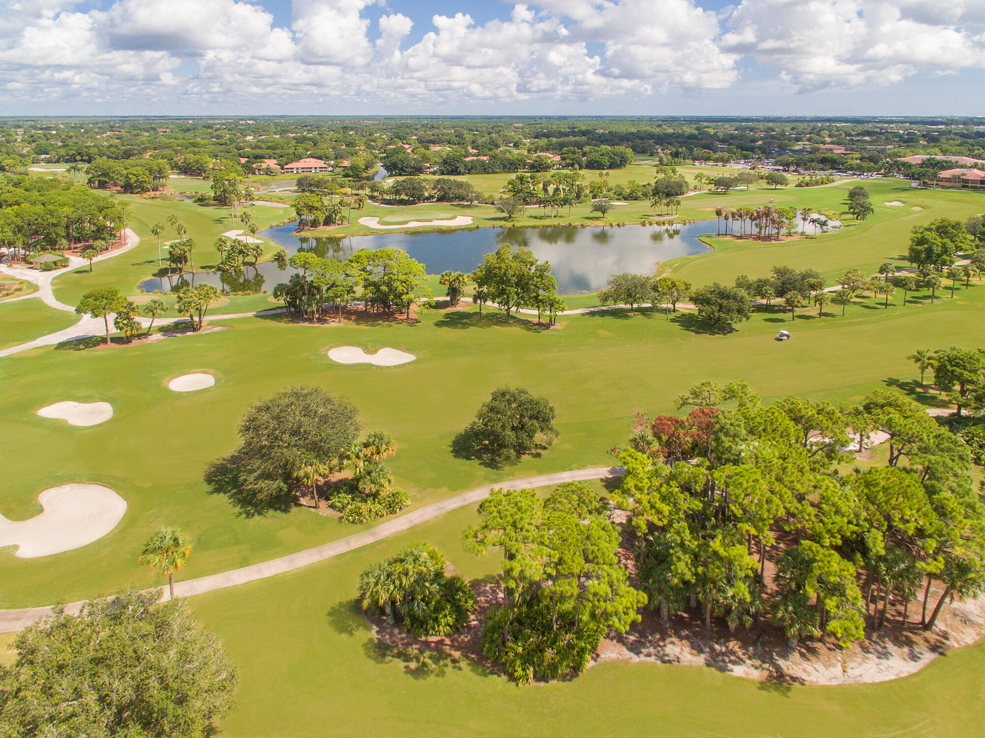 25 Commodore Place Palm Beach Gardens, FL 33418 - Photo 41 of 68 a view of a lake with a nearby beach