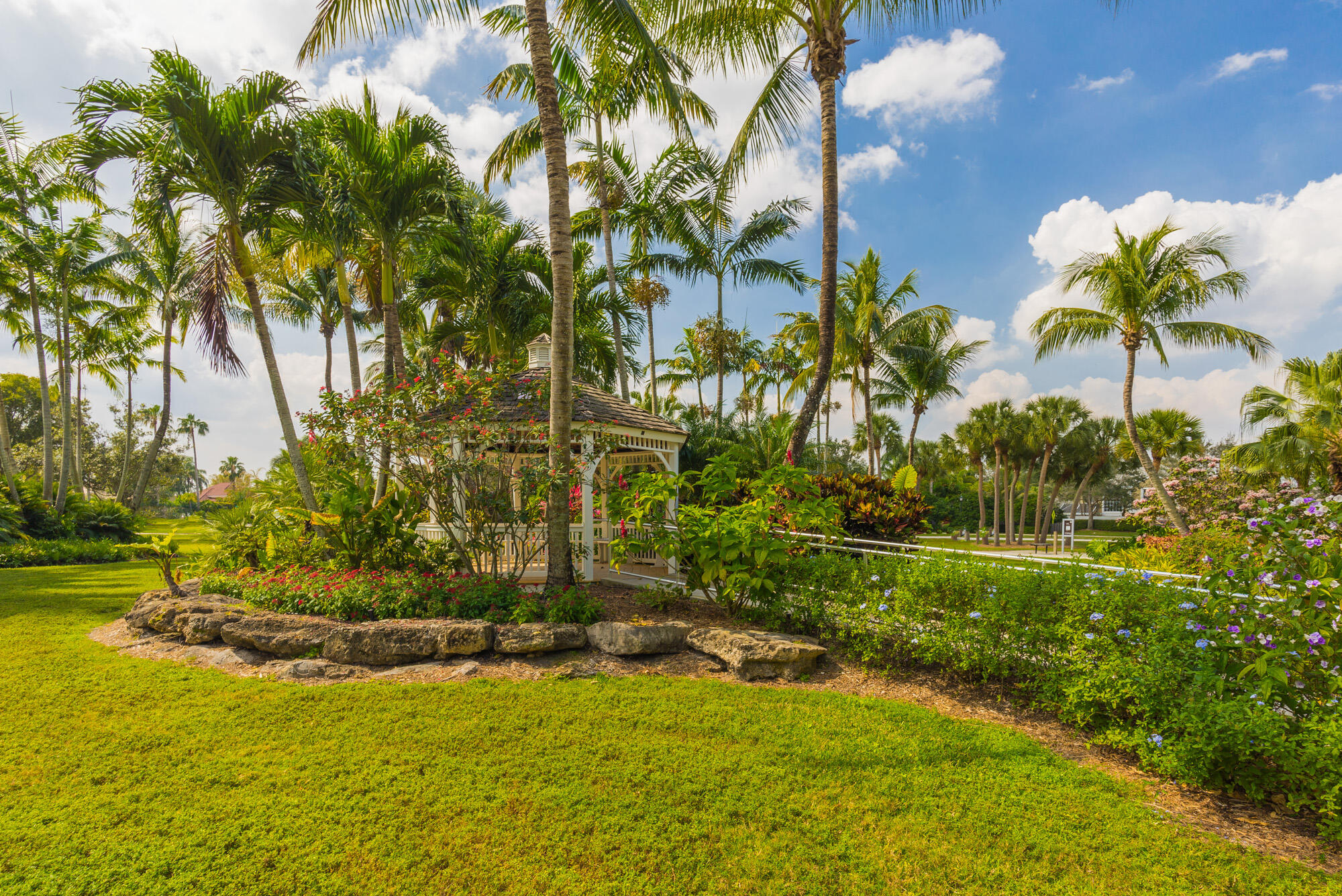 25 Commodore Place Palm Beach Gardens, FL 33418 - Photo 45 of 68 a view of a swimming pool with a yard