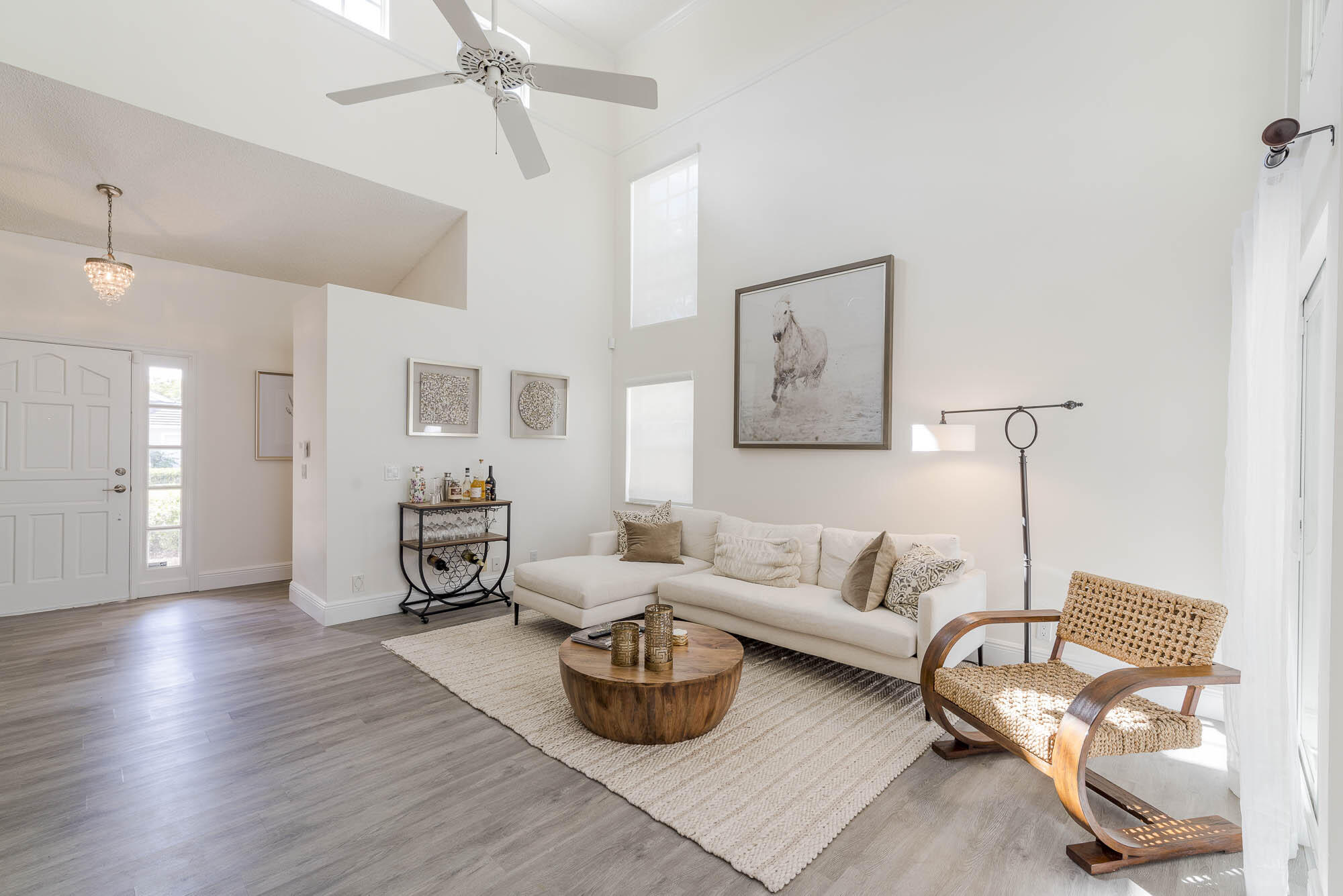 25 Commodore Place Palm Beach Gardens, FL 33418 - Photo 5 of 68 a living room with furniture and a wooden floor