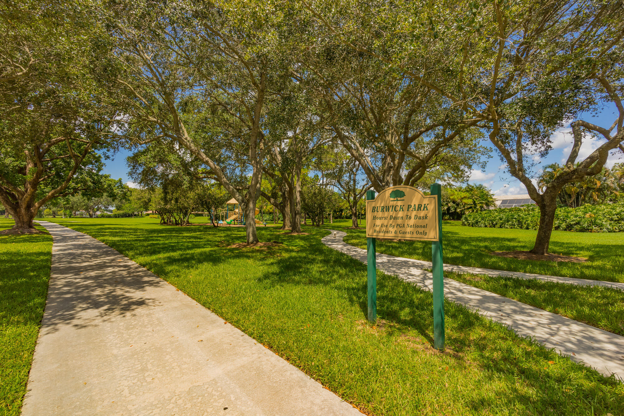 25 Commodore Place Palm Beach Gardens, FL 33418 - Photo 60 of 68 a view of a park with large trees