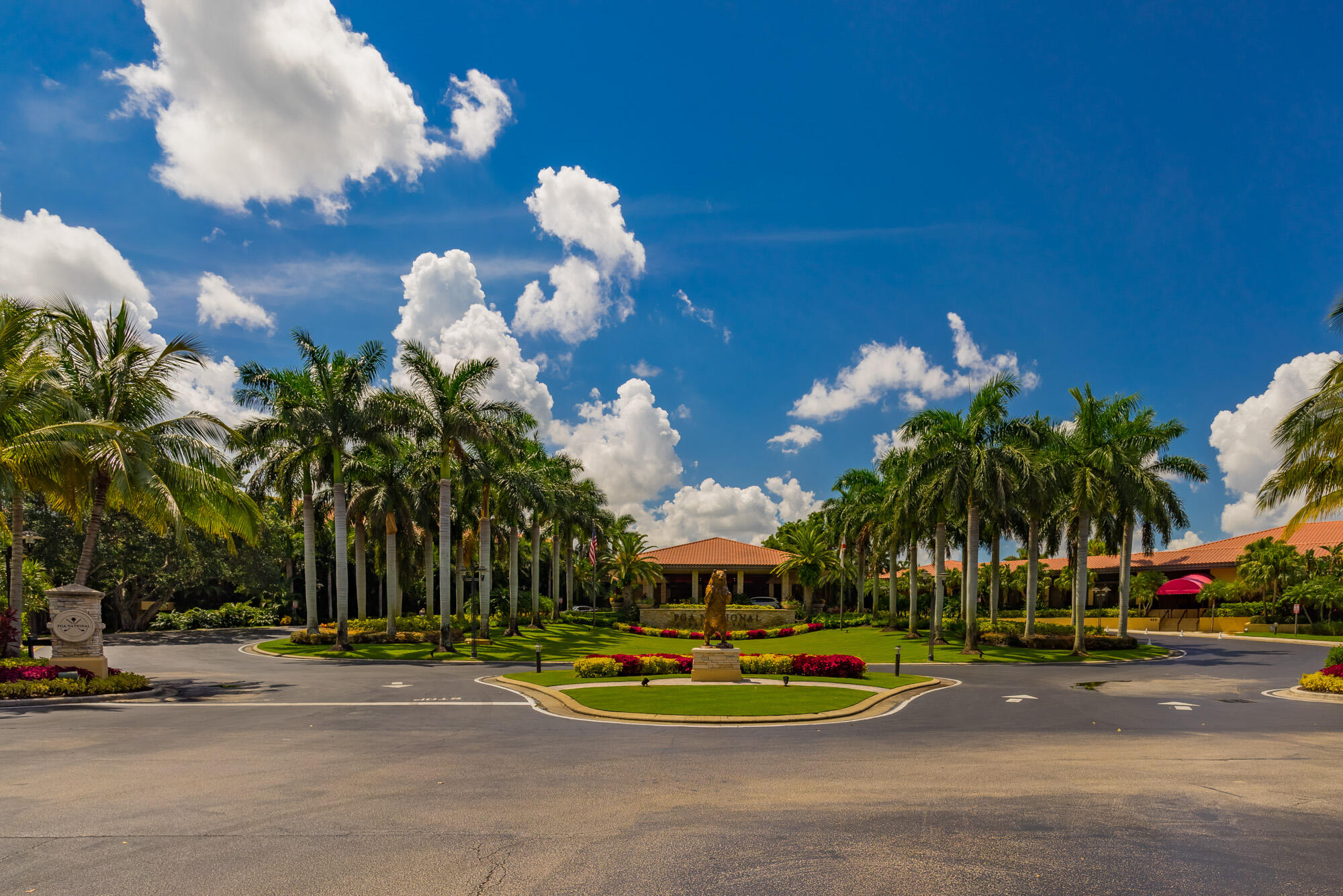 25 Commodore Place Palm Beach Gardens, FL 33418 - Photo 66 of 68 a swimming pool with a yard and palm trees