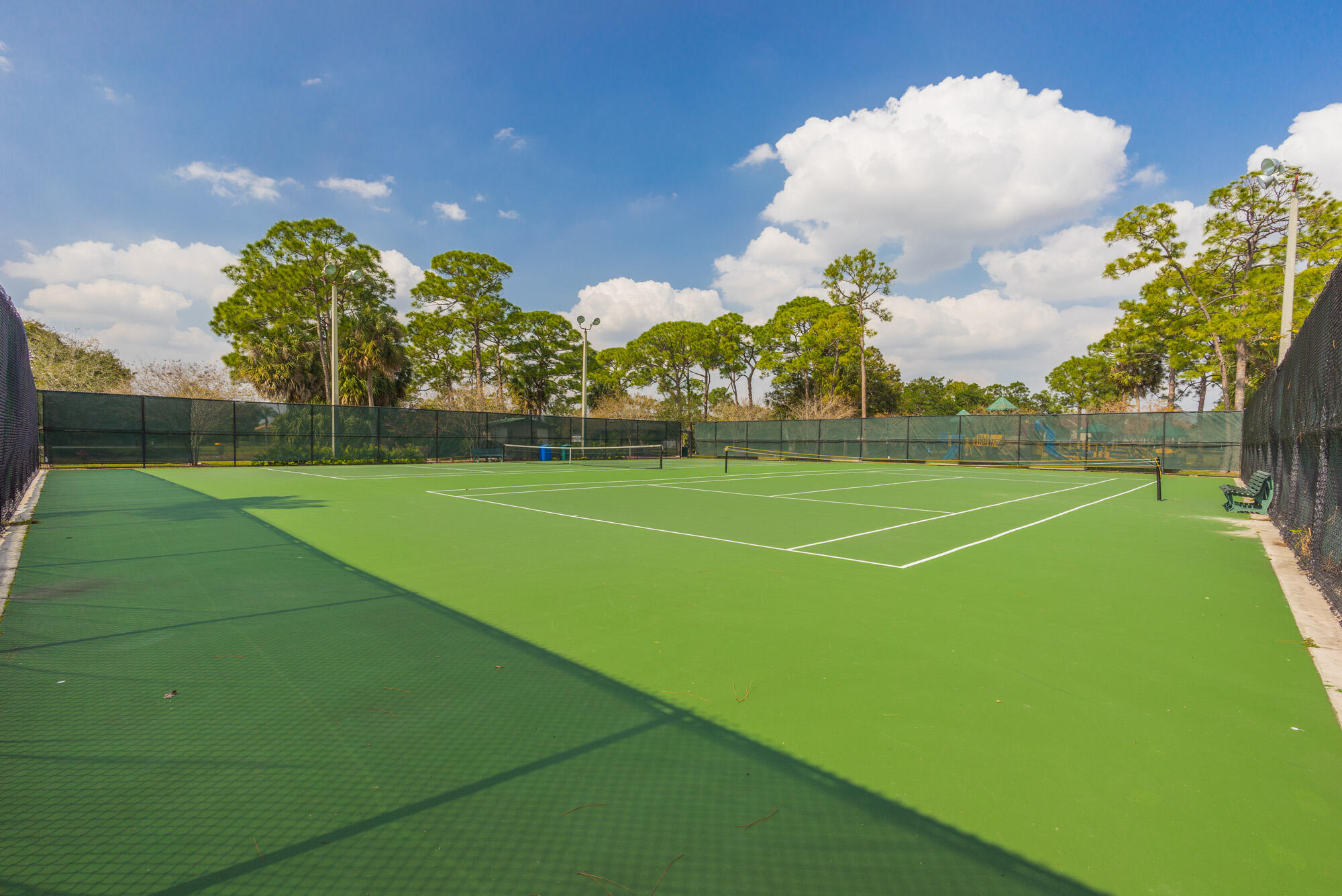 25 Commodore Place Palm Beach Gardens, FL 33418 - Photo 68 of 68 a view of a tennis ground