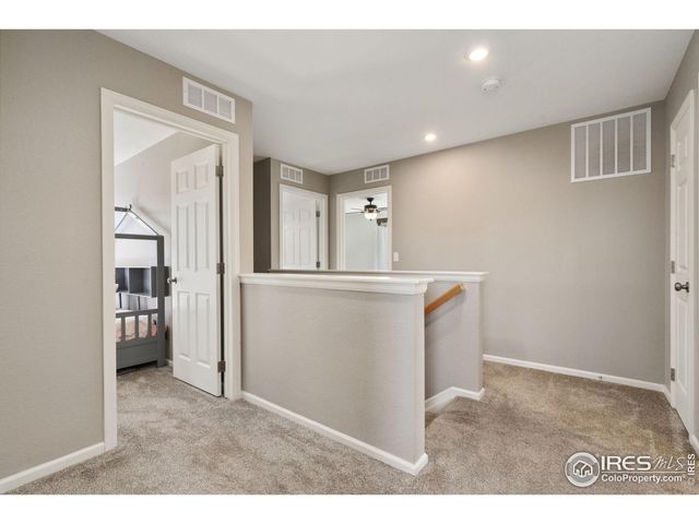 a room with a sink and a large mirror