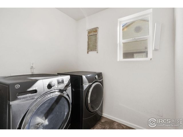 a view of walk in closet with clothes