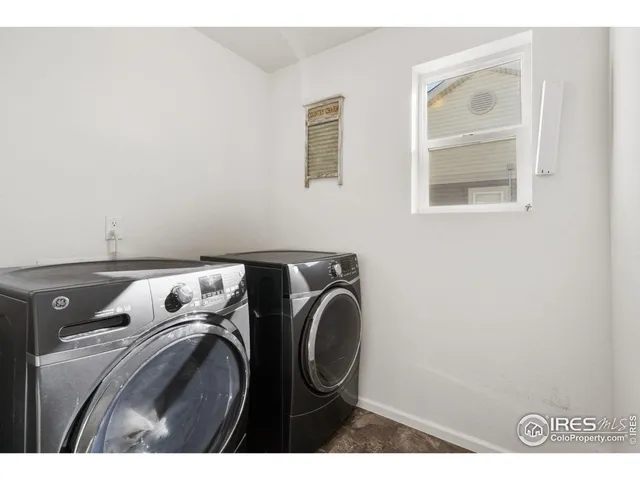 a view of walk in closet with clothes