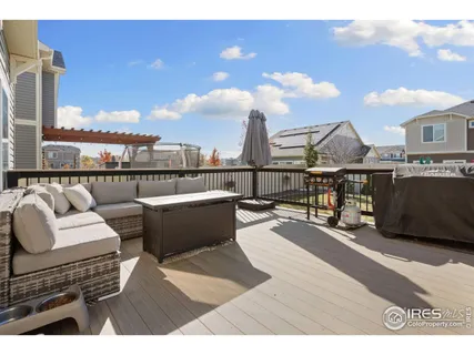 a house view with a wooden deck