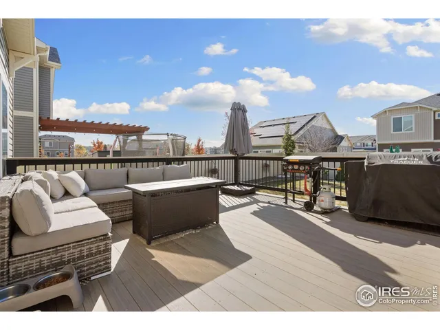 a house view with a wooden deck