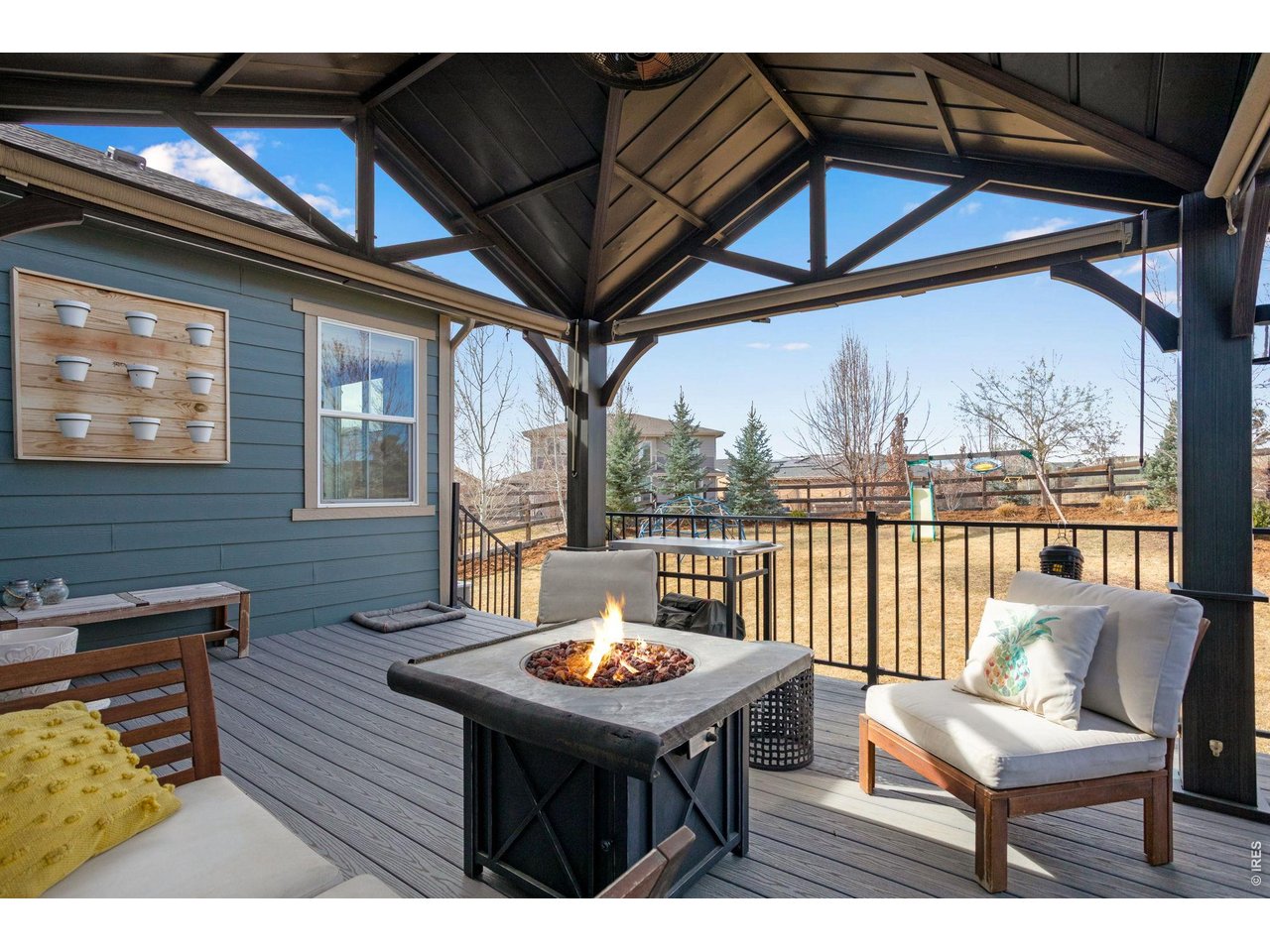 12715 Eagle River Road Firestone, CO 80504 - Photo 19 of 28 Covered outdoor living at its finest - spacious deck with pergola and room to relax or entertain year-round.