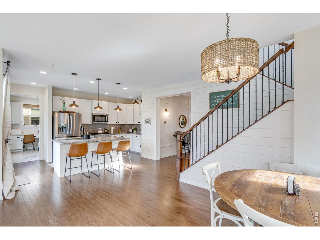 12715 Eagle River Road Firestone, CO 80504 - Photo 9 of 28 Spacious kitchen with center island-granite countertops, stainless appliances, and bar seating.