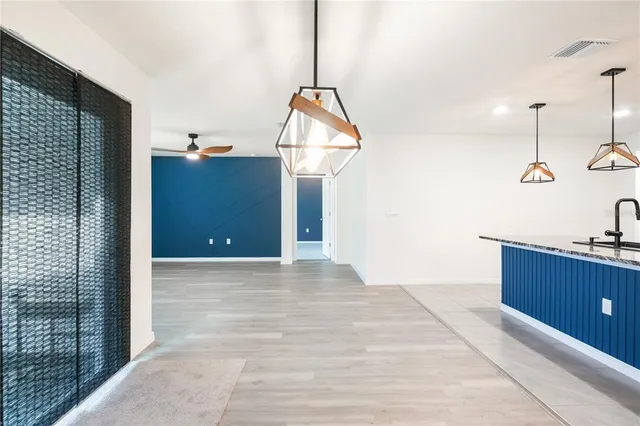 a view of a room with cabinet and mirror