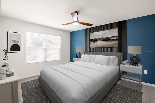 a bedroom with a bed and a window