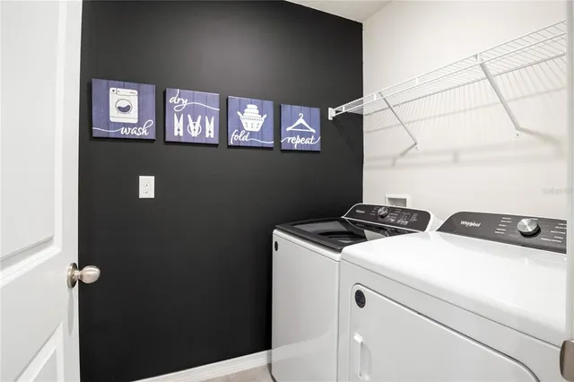a utility room with dryer and washer