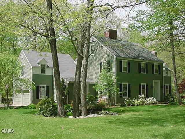 31 Pheasant Run Road Wilton, CT 06897 - Photo 1 of 1 a front view of a house with a garden