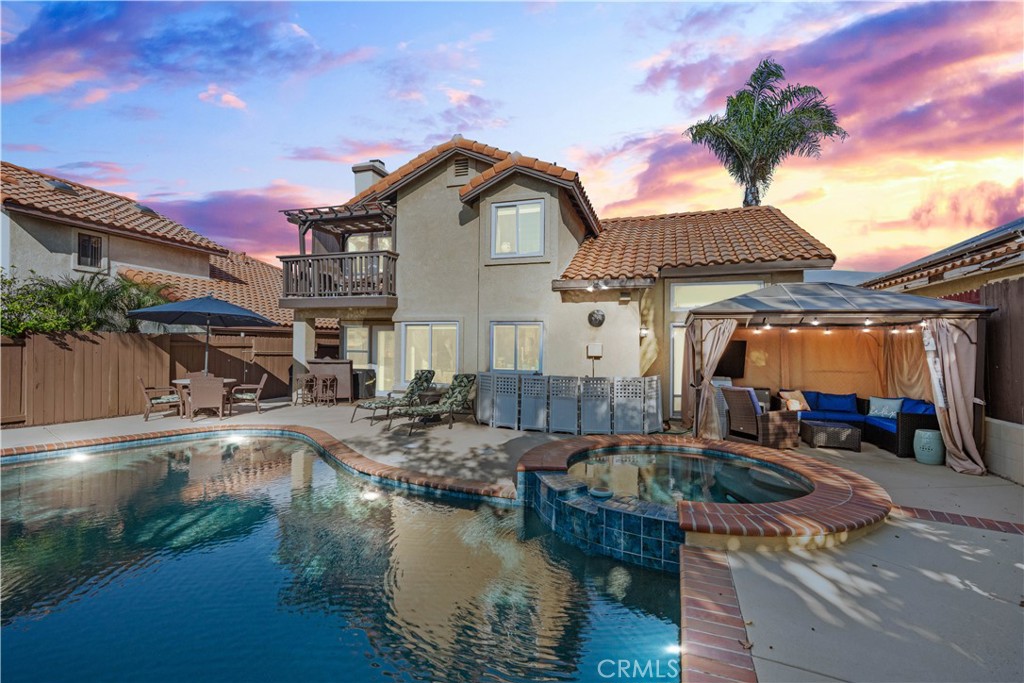 10963 San Mateo Place Rancho Cucamonga, CA 91701 - Photo 1 of 37 a front view of house with yard and lake view