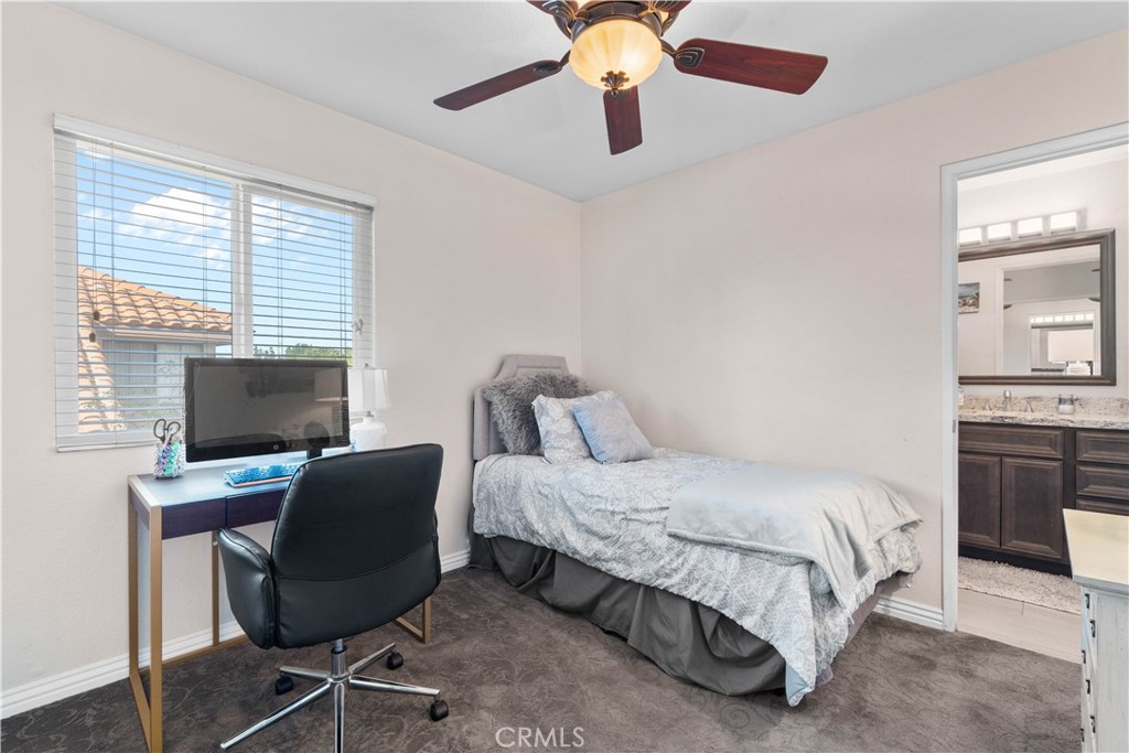 10963 San Mateo Place Rancho Cucamonga, CA 91701 - Photo 26 of 37 a bedroom with a bed and a desk
