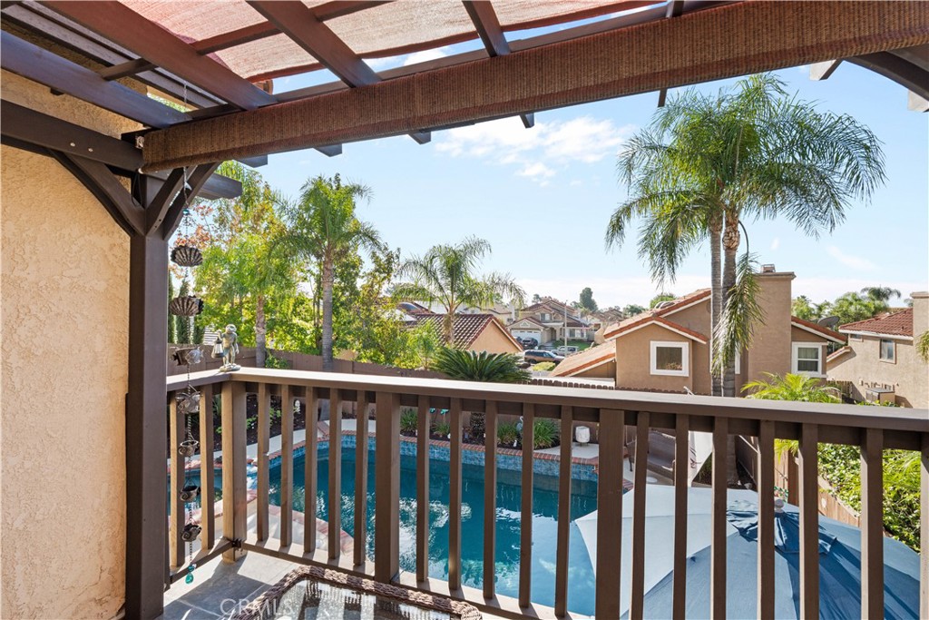 10963 San Mateo Place Rancho Cucamonga, CA 91701 - Photo 30 of 37 a view of a balcony with palm trees