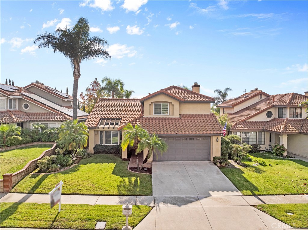 10963 San Mateo Place Rancho Cucamonga, CA 91701 - Photo 33 of 37 a front view of a house with a yard table and chairs