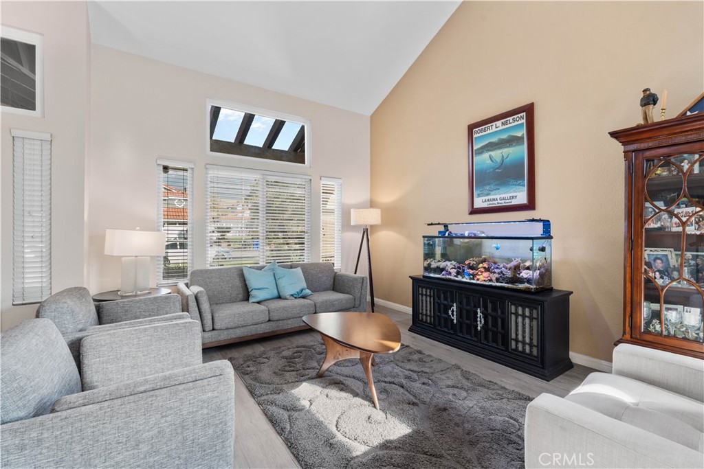 10963 San Mateo Place Rancho Cucamonga, CA 91701 - Photo 7 of 37 a living room with furniture and a painting on the wall