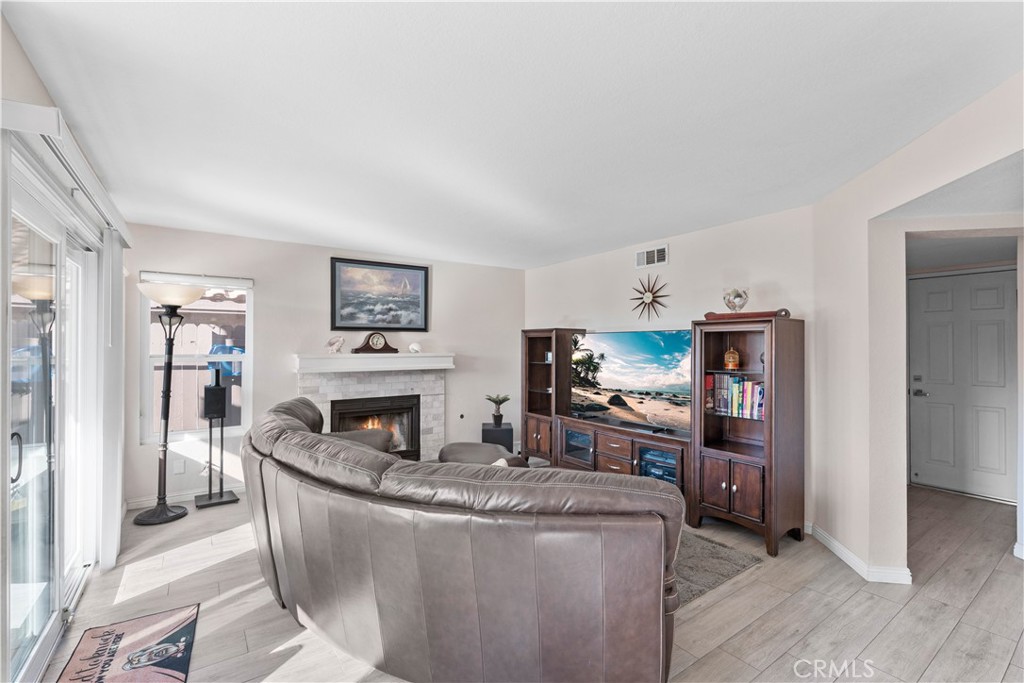 10963 San Mateo Place Rancho Cucamonga, CA 91701 - Photo 8 of 37 a living room with fireplace furniture and a flat screen tv